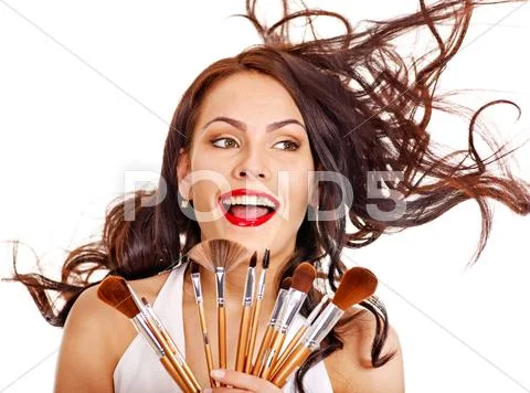 Girl applying makeup. Stock Photos