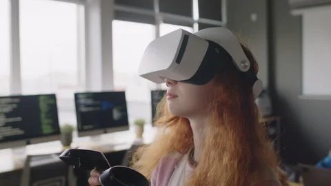 Girl in AR Headset Experiencing Virtual Reality at Coding School Video stock 278129878