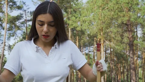 Girl archer pulling the string on her bow Video stock 96760632