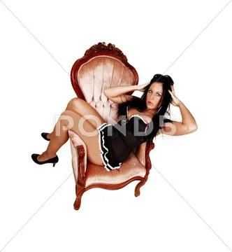 Girl in armchair. Stock Photos