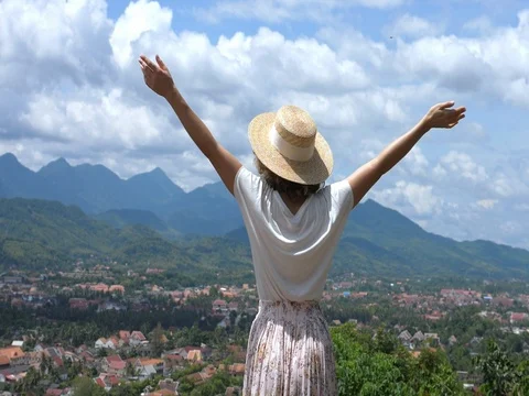 Girl With Arms Wide Open On Top Of Mountain Watching Beautiful Scenery Stock Footage