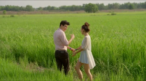 Girl asks guy to hold her hand Stock Footage 63077615