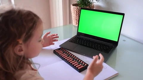 A girl from the back is engaged in mental arithmetic on the abacus online  Stock Footage 240925064