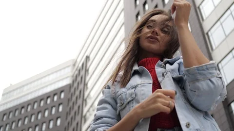Girl on the background of buildings posing Stock Footage 105060922