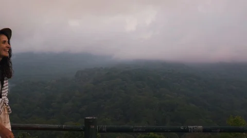Girl on the background of the jungle Stock Footage 129056161