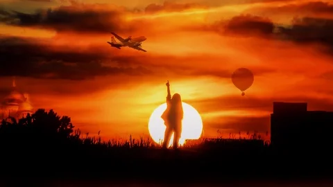 Girl on the background of large sun Stock Footage 106609400