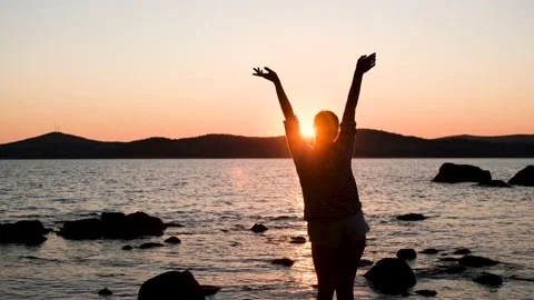Girl on the background of the sunset Stock Footage 161422822