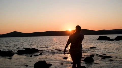 Girl on the background of the sunset Stock Footage 161423139