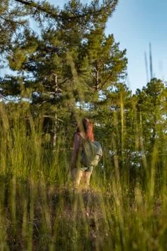 Girl with backpack at the forest Stock Photos