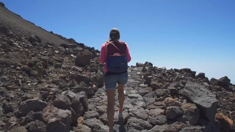 Girl with a backpack up the mountain Video stock 71515703