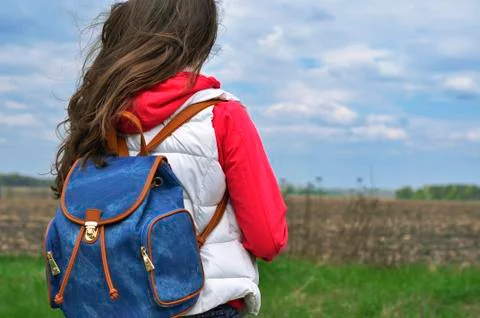 Girl with backpack Stock Photos