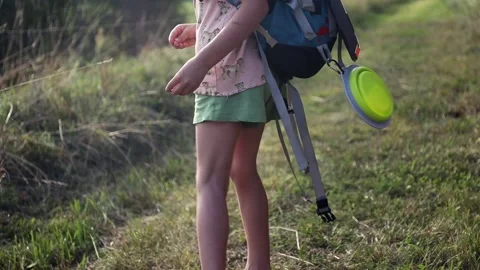 Girl with backpack walking on the rural path. Adventure, travel, eco concept. Stock Footage 157892121