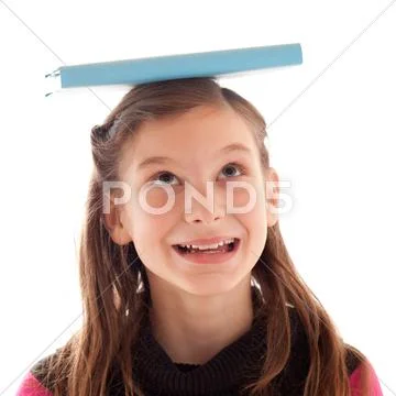 Girl balancing a book on her head Stock-Fotos