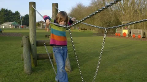 Girl balancing in playground Stock Footage 22226690