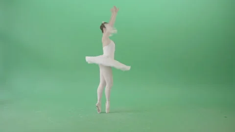 Girl in ballet white dress performs in green screen studio spinning elegantly Stock Footage 144583229