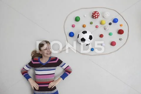 Girl with balls in speech bubble Stock Photos