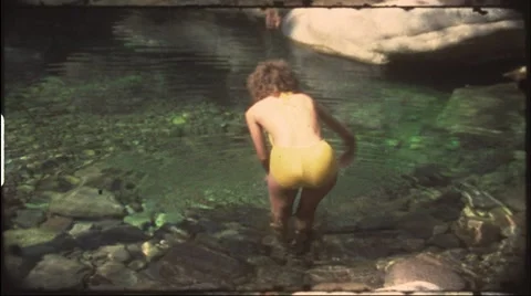 Girl in bathing suit diving in pool (vintage 8 mm amateur film) Stock Footage 7733206