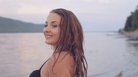 Girl on the beach looking at the camera Stock Footage 66236333