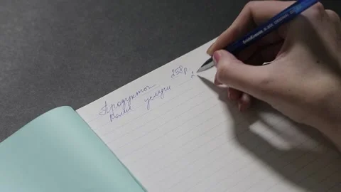 A girl with a beautiful hand writes a script in a clean notebook 스톡 동영상 158909652