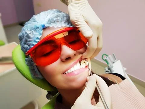 Girl with beautiful teeth at denstis Stock Photos