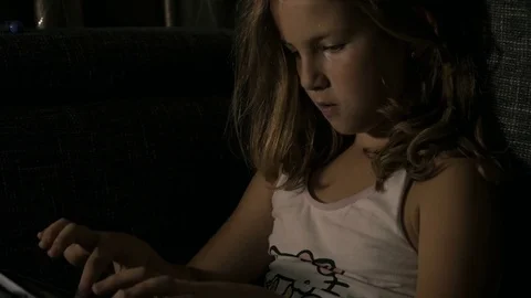 Girl in bed playing with tablet 1 Stock-Footage 77301978
