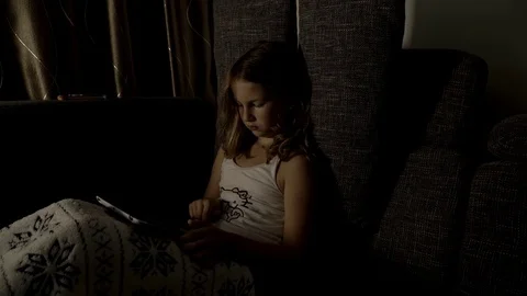 Girl in bed playing with tablet Video stock 77301964