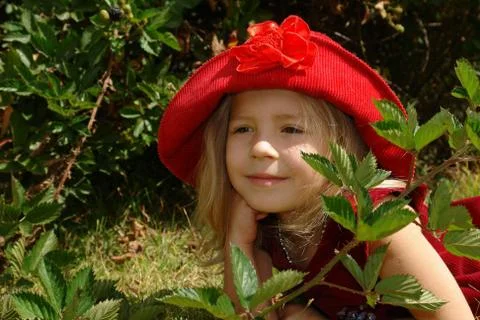 Girl in big red vintage romantic hat. Stock Photos