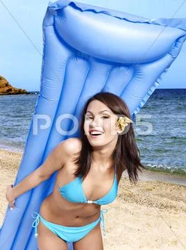 Girl in bikini on beach. Stock Photos