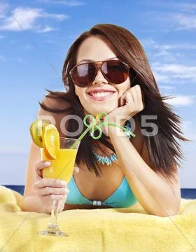 Girl in bikini drinking cocktail. Stock Photos