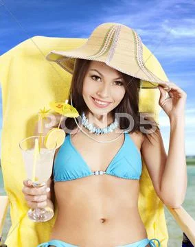 Girl in bikini drinking cocktail. Stock Photos