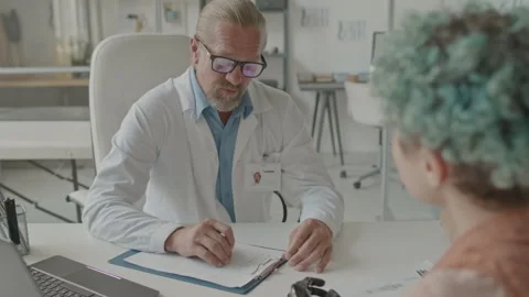 Girl with Bionic Arm Having Appointment at Prosthetist Office Stock Footage 251874872