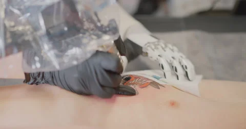 The girl with the bionic hand is making tattoo Bionics Stock Footage 152636510