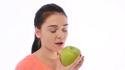 Girl Bites an Apple and Feels Bad Stock Footage 59133803