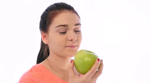 Girl Bites an Apple and Smiles Stock Footage 59133826