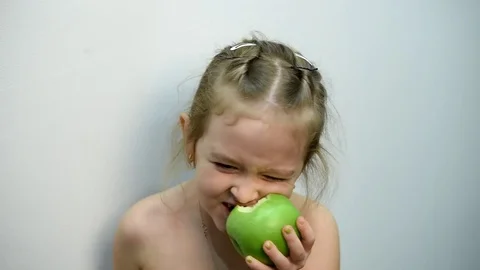 Girl biting the Apple Stock Footage 72423339