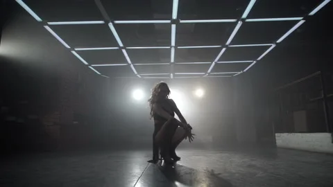 A girl in black clothes is dancing Видео 87798809