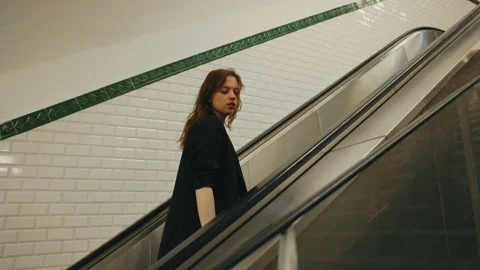 Girl In Black Jacket Climbs Elevator In Subway. Stock Footage 288707945
