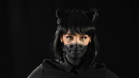 Girl in black makeup Stock Footage 129555004
