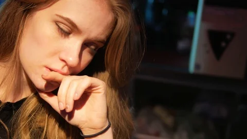 Girl blonde programmer thinks how to write program code Stock Footage 117162680