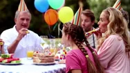 Girl Blowing Birthday Candle In Cinemagraph Stock Footage