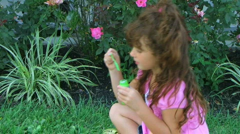 Girl Blowing Bubbles Stock Footage 221936