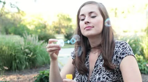 Girl blowing bubbles Stock Footage 19926440