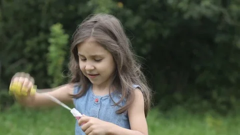 Girl is blowing the bubbles Stock Footage 78483473