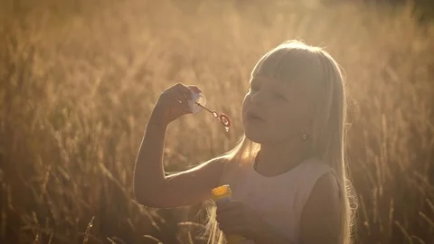 Girl blowing bubbles Stock Footage 83872335