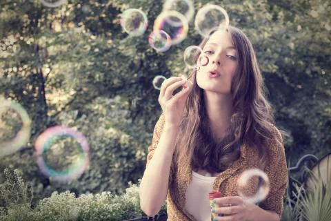 Girl Blowing Bubbles Stock Photos