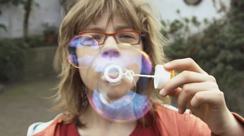 Girl blowing bubbles slow motion Stock Footage 57325918