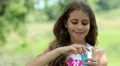 Girl blowing soap bubbles HD Footage