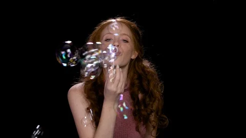 Girl blowing soap bubbles Video stock 100167549