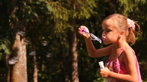 Girl blows bubbles Stock-Footage 45253375