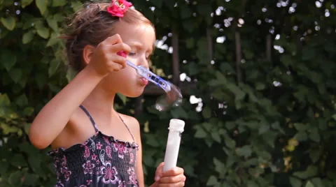 Girl blows bubbles Video stock 45329107